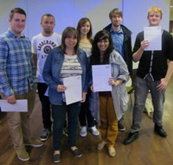 Walsall College Graphic Design students proudly holding their certificates